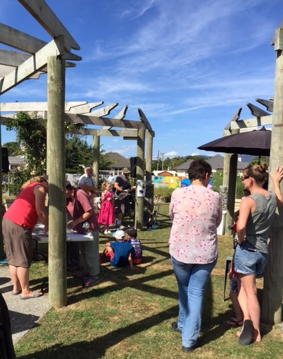 Neighbours and volunteers celebrating Clyma Park Community Garden's 5th birthday